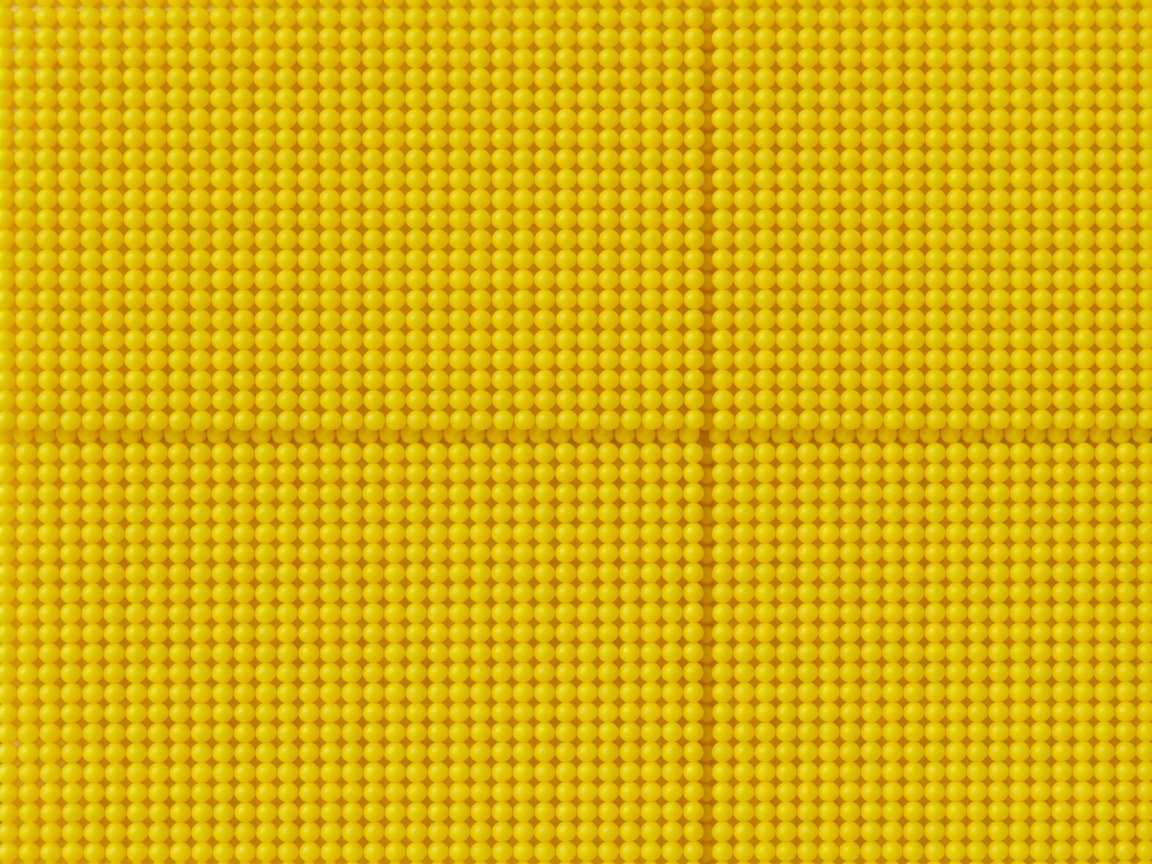 A dense array of identical small yellow objects packed tightly together